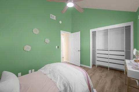 a bedroom with a bed and a dresser