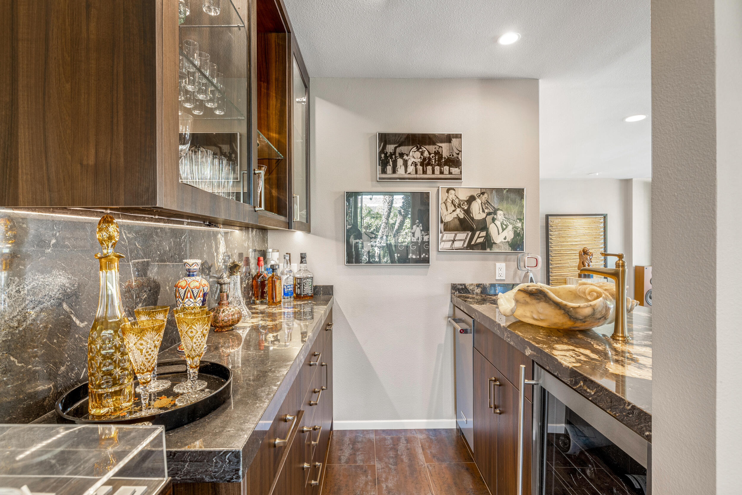 15 Johnar Boulevard Rancho Mirage, CA 92270 - Photo 14 of 68 a kitchen with stainless steel appliances kitchen island granite countertop a sink and cabinets
