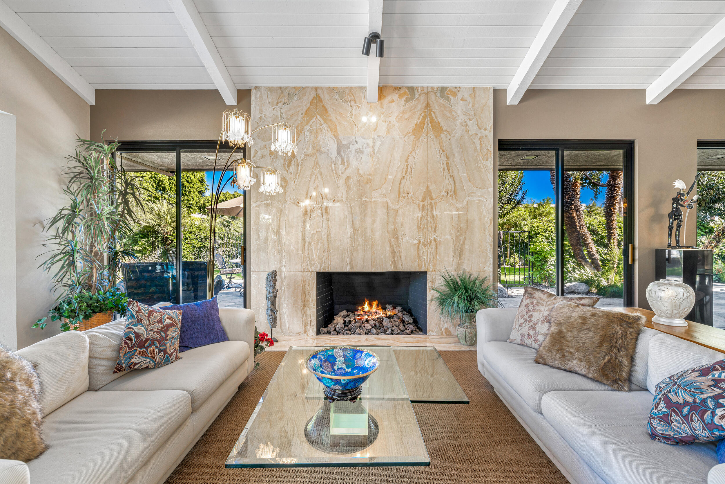 15 Johnar Boulevard Rancho Mirage, CA 92270 - Photo 18 of 68 a living room with furniture and a fireplace