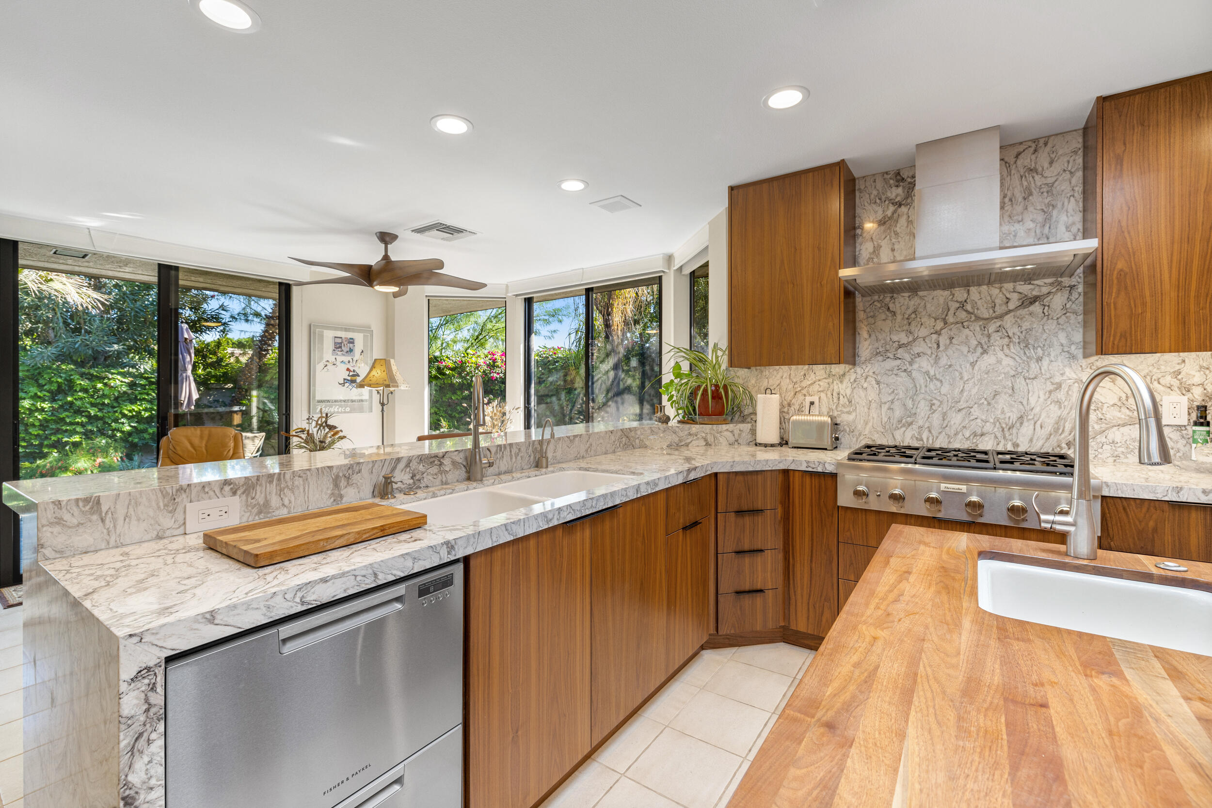 15 Johnar Boulevard Rancho Mirage, CA 92270 - Photo 24 of 68 a kitchen with granite countertop stainless steel appliances and sink