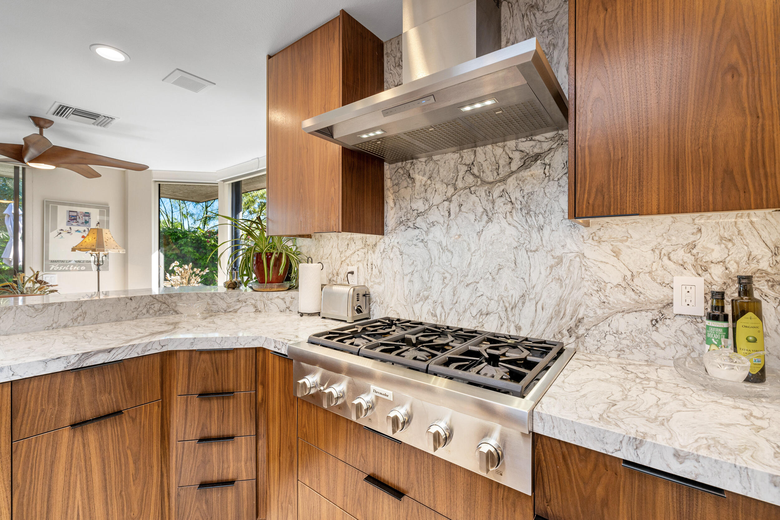 15 Johnar Boulevard Rancho Mirage, CA 92270 - Photo 25 of 68 a kitchen with granite countertop a stove and a sink