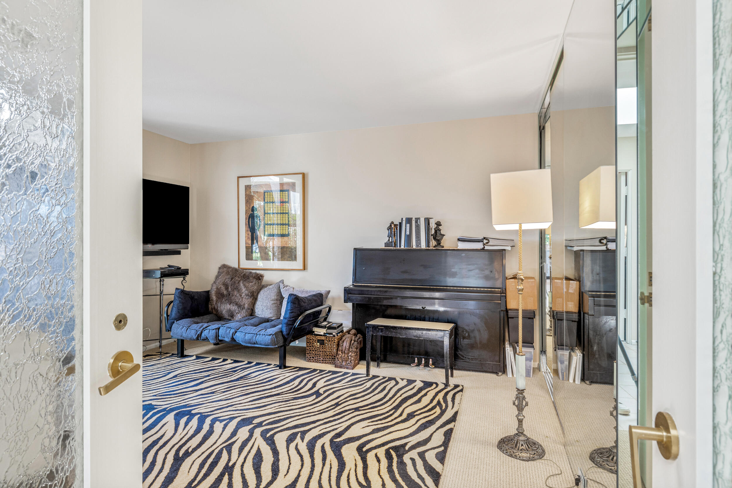 15 Johnar Boulevard Rancho Mirage, CA 92270 - Photo 38 of 68 a living room with furniture a fireplace and a flat screen tv