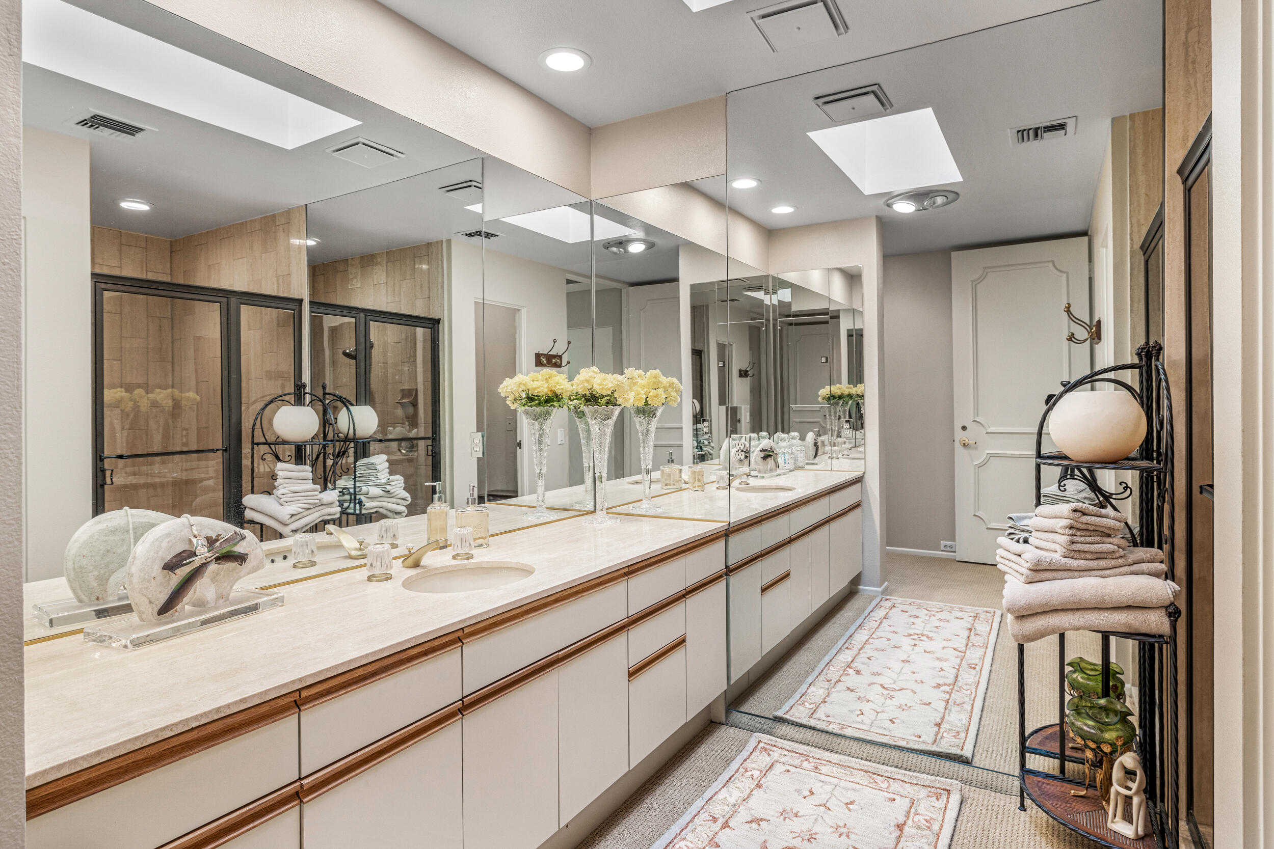 15 Johnar Boulevard Rancho Mirage, CA 92270 - Photo 39 of 68 a bathroom with a double vanity sink and a mirror
