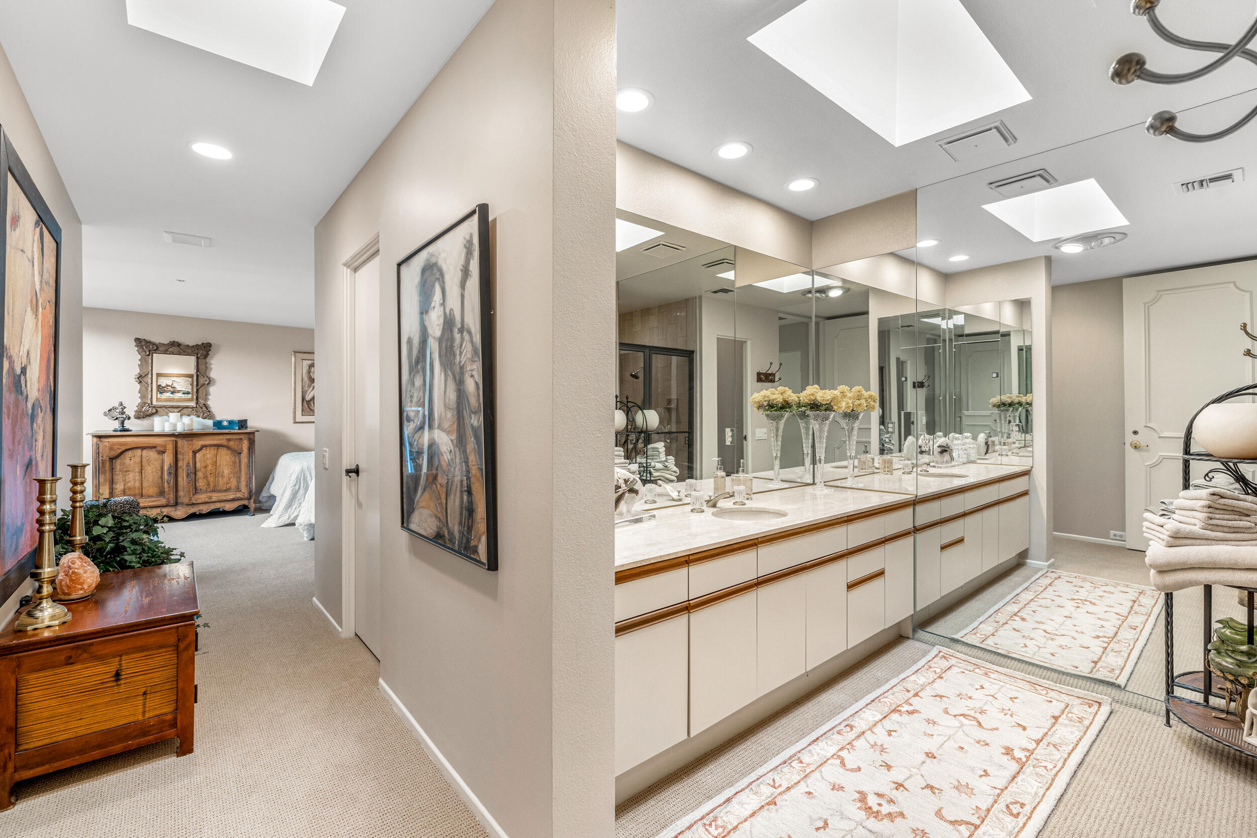 15 Johnar Boulevard Rancho Mirage, CA 92270 - Photo 40 of 68 a bathroom with a double vanity sink and a mirror