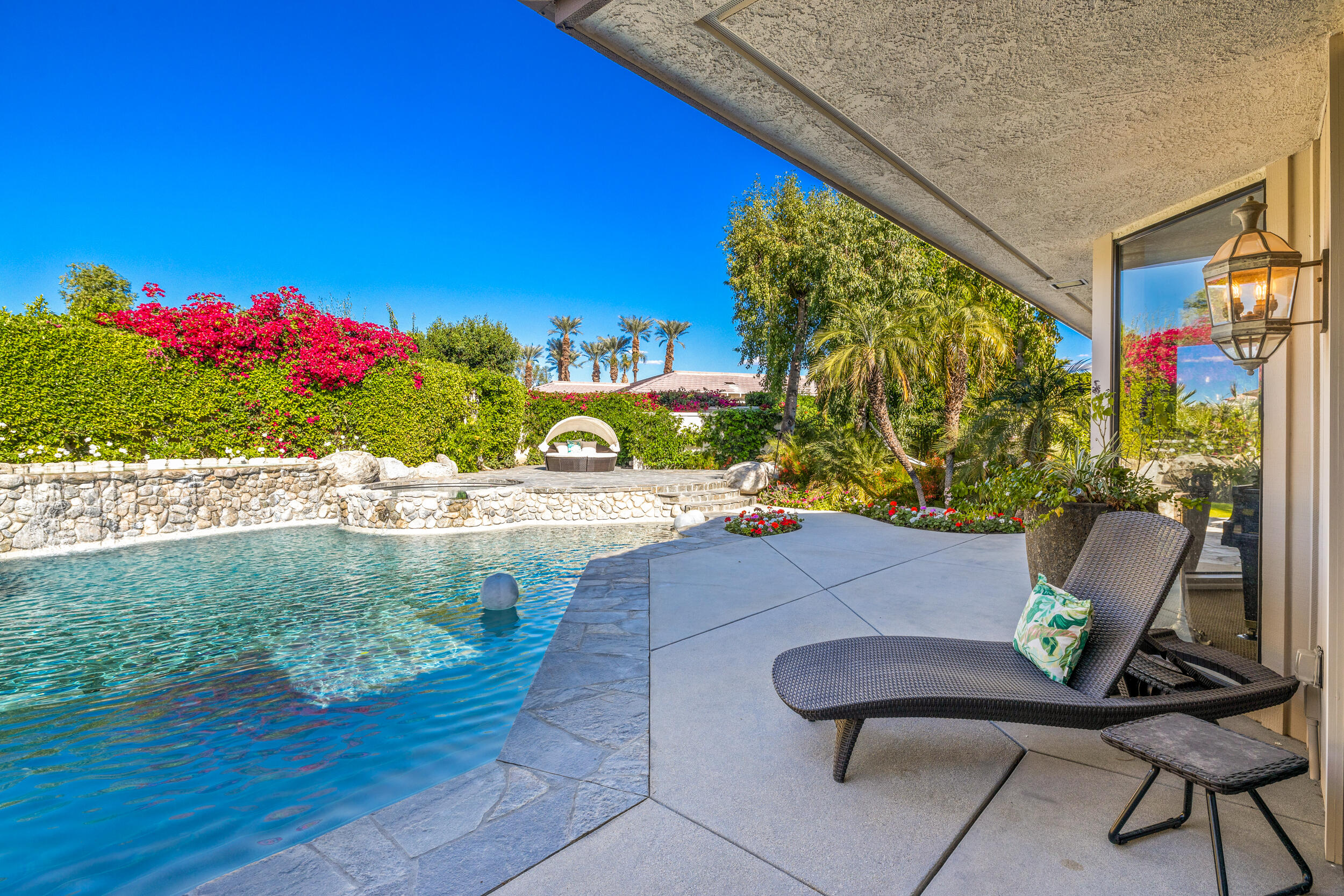 15 Johnar Boulevard Rancho Mirage, CA 92270 - Photo 42 of 68 a view of a chairs and table in a backyard
