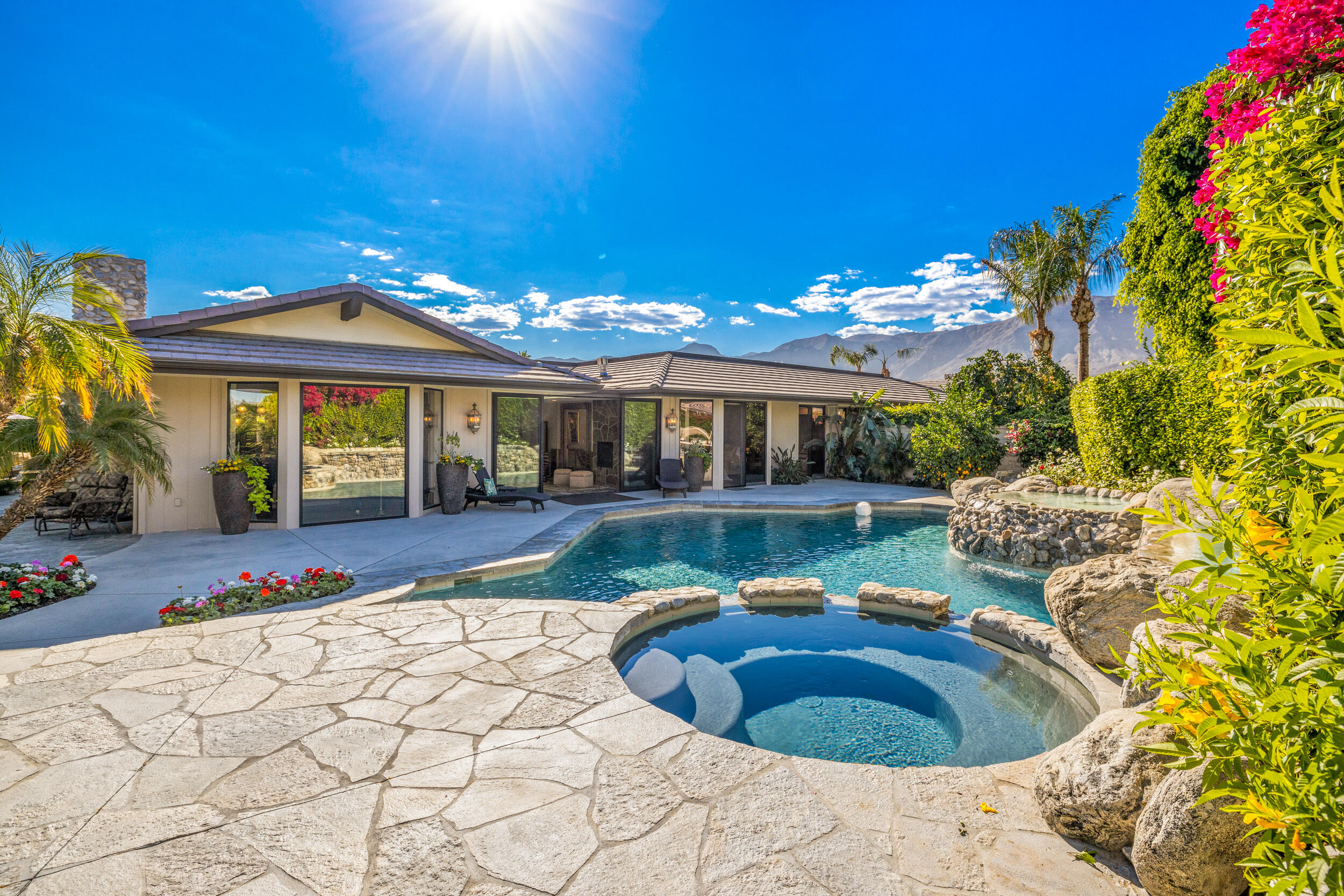 15 Johnar Boulevard Rancho Mirage, CA 92270 - Photo 45 of 68 a view of a house with swimming pool and sitting area