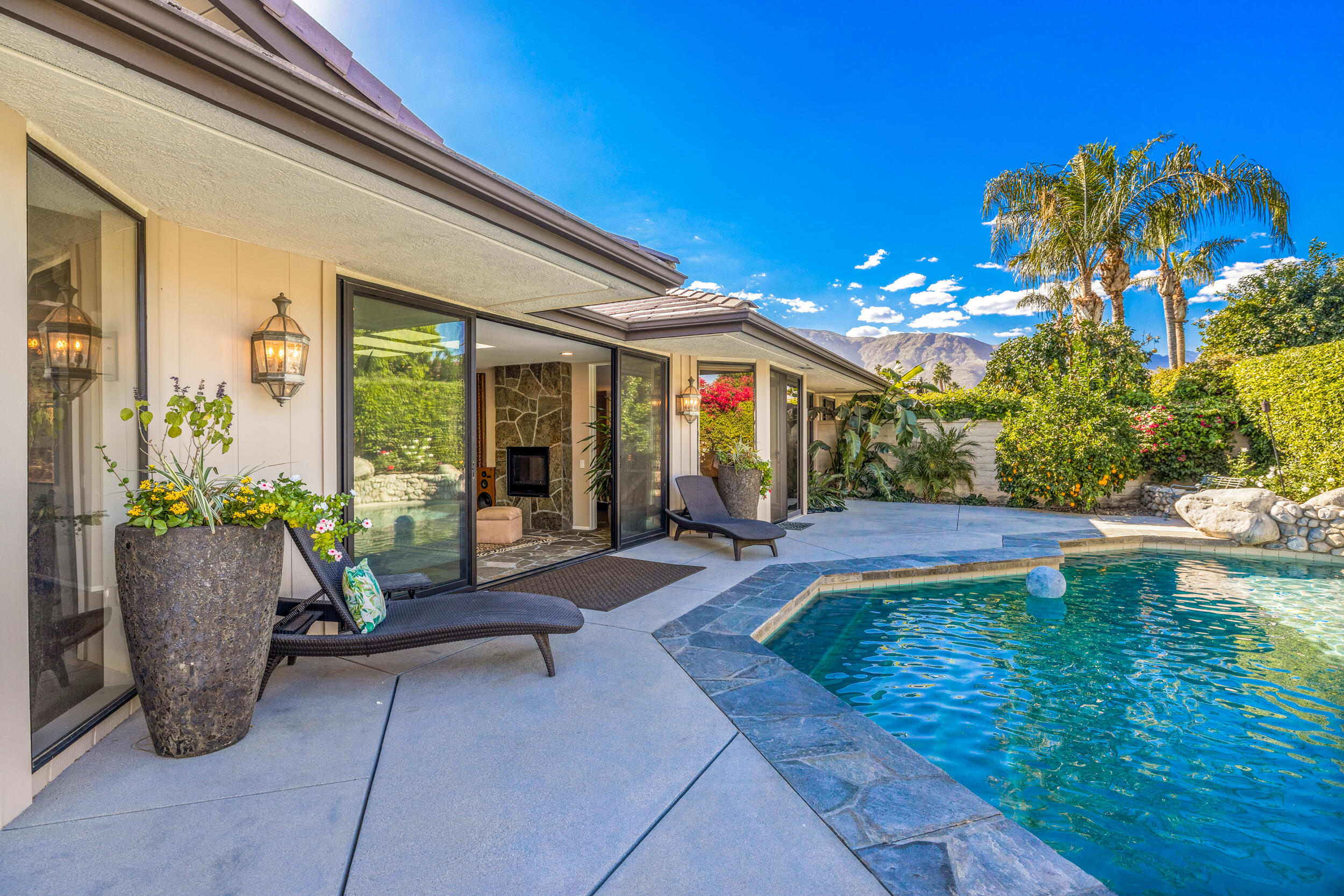 15 Johnar Boulevard Rancho Mirage, CA 92270 - Photo 47 of 68 a view of a house with swimming pool and sitting area