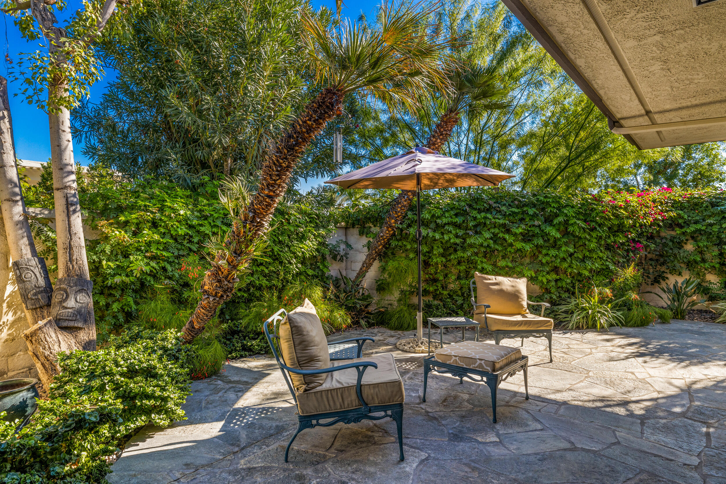 15 Johnar Boulevard Rancho Mirage, CA 92270 - Photo 51 of 68 a backyard of a house with table and chairs
