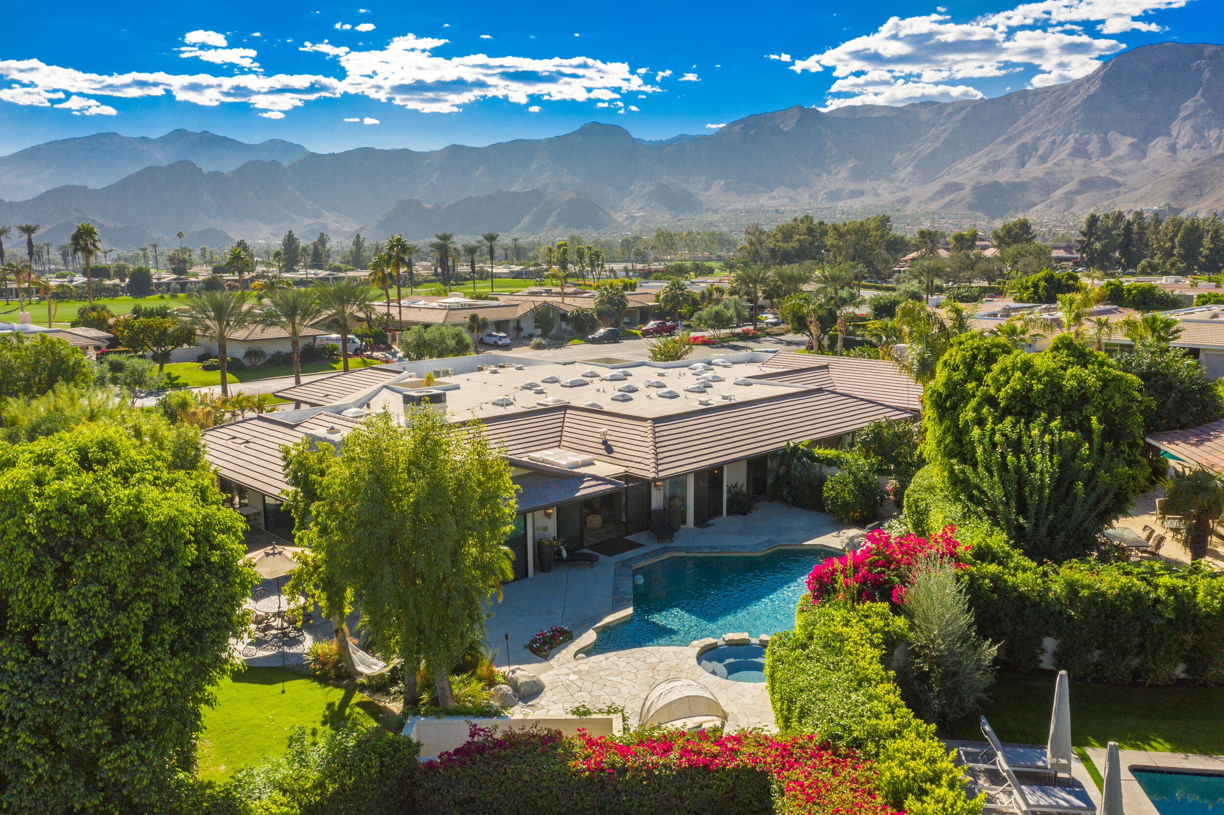 15 Johnar Boulevard Rancho Mirage, CA 92270 - Photo 54 of 68 a view of a city with flower plants in front of house