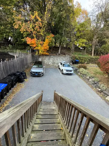 a view of backyard with seating and green space