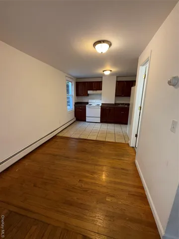 a view of a livingroom with wooden floor