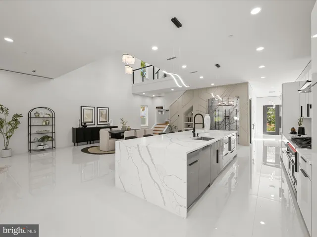 a living room with furniture a clock and a fireplace