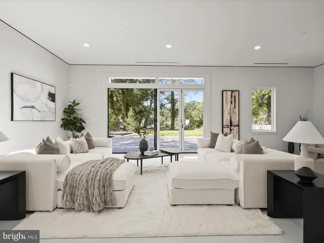 a bedroom with a large bed and a large window