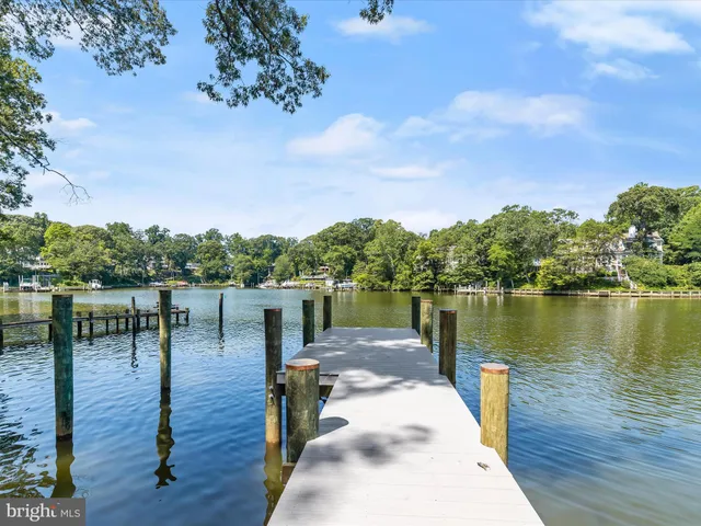 a view of a workspace with furniture and window