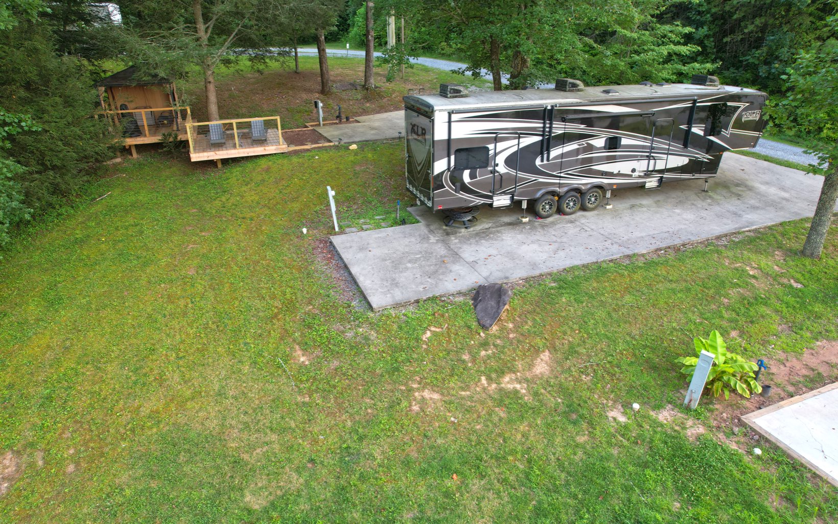 Meadow Hill Morganton, GA 30560 - Photo 27 of 30 a view of a swimming pool with lawn chairs and a fire pit