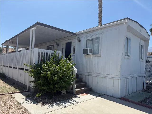 a backyard of a house with plants