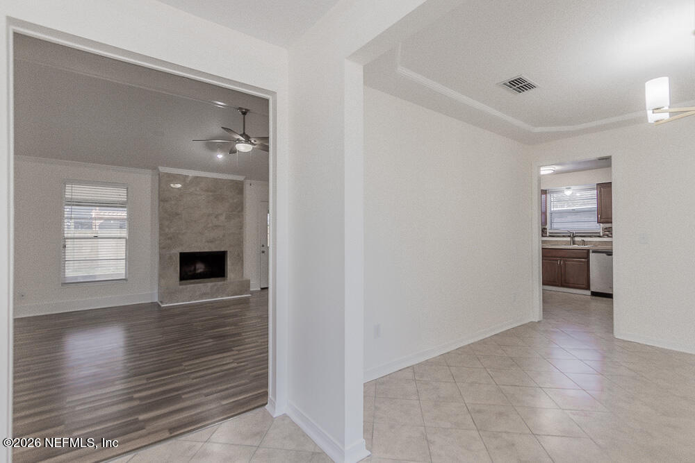 8209 Worm Wood Road Jacksonville, FL 32210 - Photo 14 of 44 a view of a kitchen with wooden floor and a kitchen space