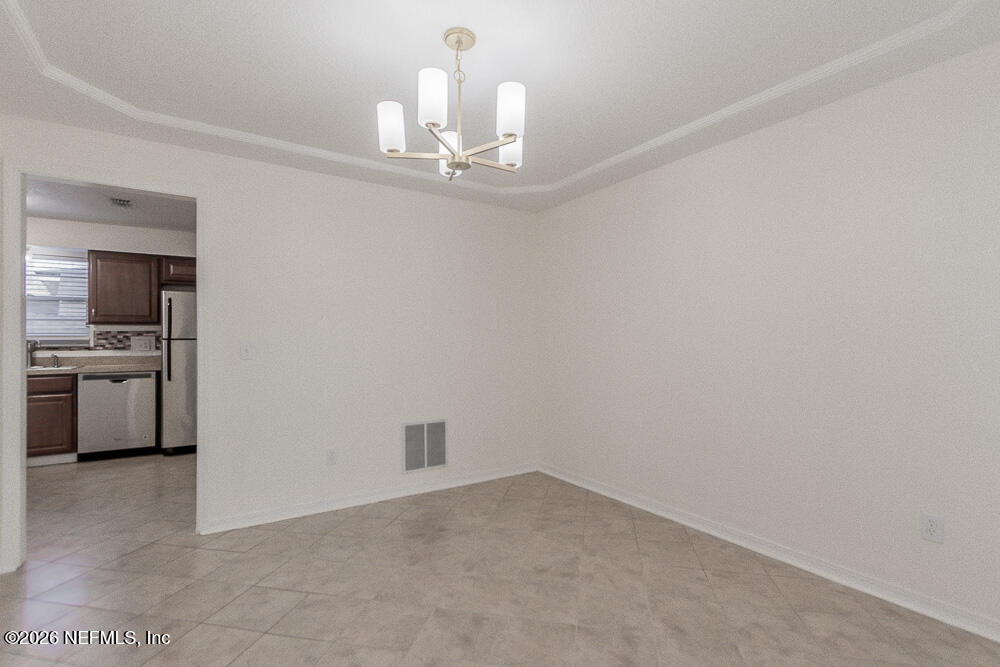 8209 Worm Wood Road Jacksonville, FL 32210 - Photo 23 of 44 a view of a kitchen with a sink and dishwasher kitchen view