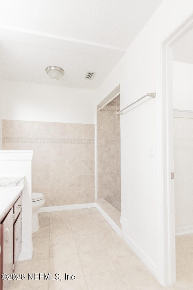8209 Worm Wood Road Jacksonville, FL 32210 - Photo 28 of 44 a bathroom with a shower and a toilet