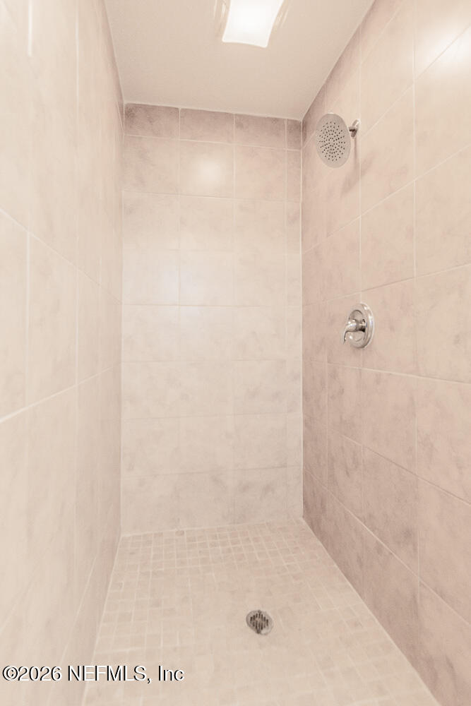 8209 Worm Wood Road Jacksonville, FL 32210 - Photo 29 of 44 a bathroom with a shower