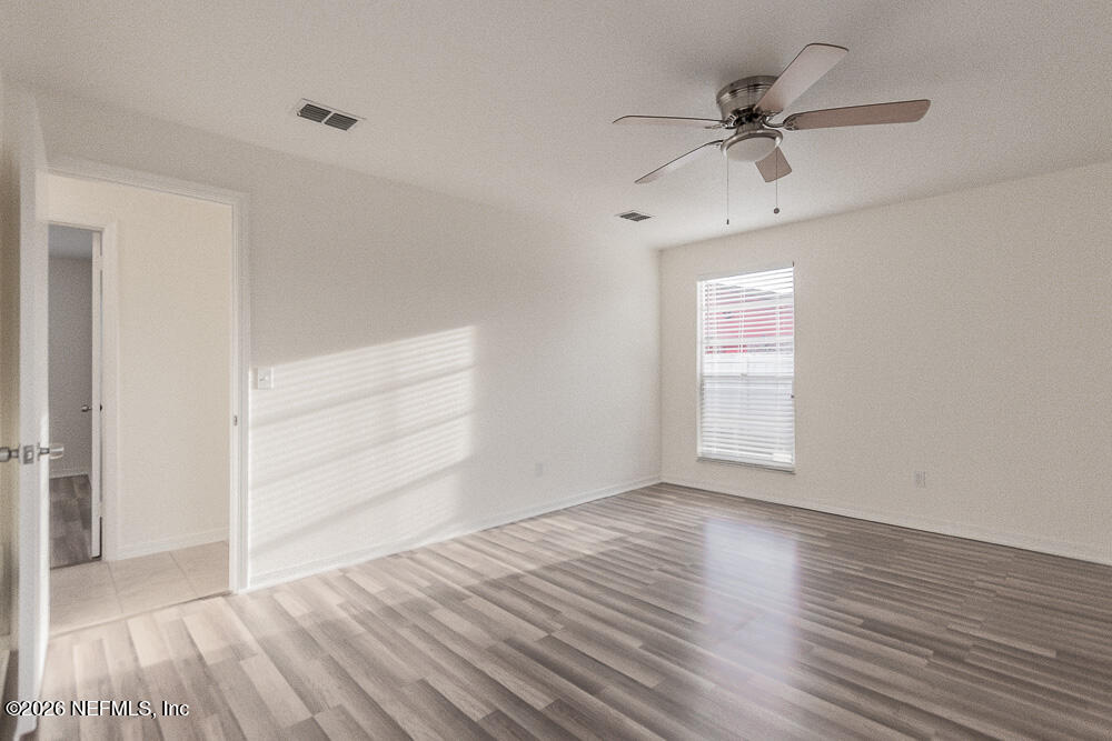 8209 Worm Wood Road Jacksonville, FL 32210 - Photo 31 of 44 wooden floor in an empty room