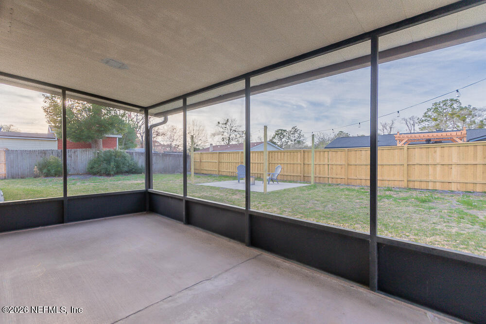 8209 Worm Wood Road Jacksonville, FL 32210 - Photo 39 of 44 a view of an outdoor space with a floor to ceiling window