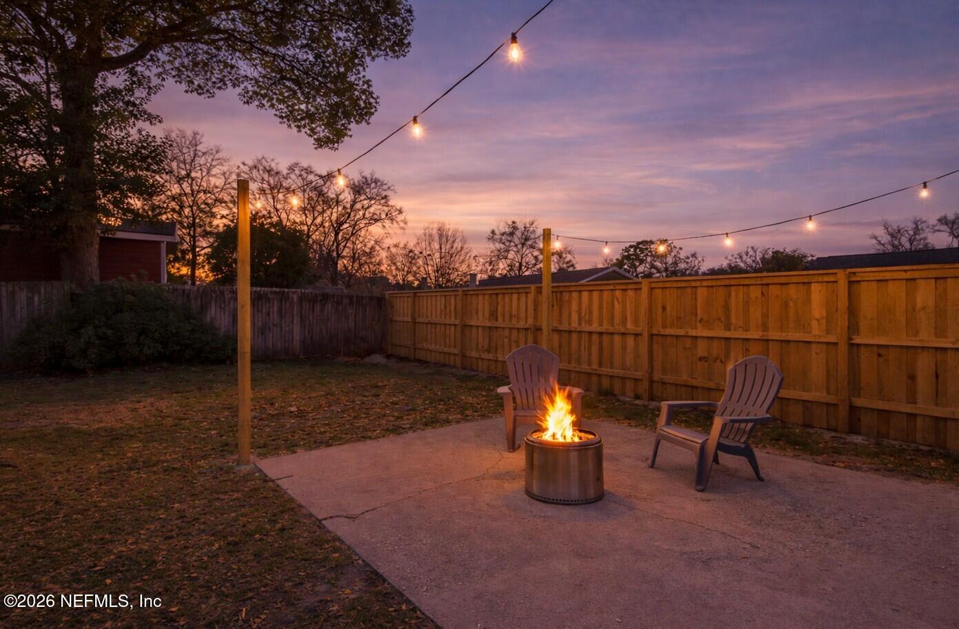 8209 Worm Wood Road Jacksonville, FL 32210 - Photo 9 of 44 a view of a chairs and table in the patio