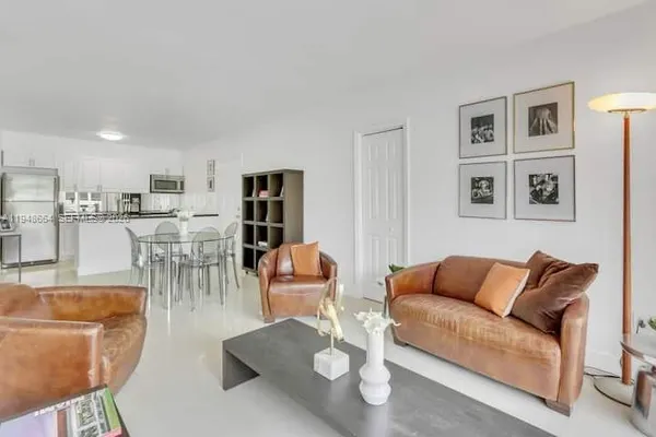 a living room with furniture and a table