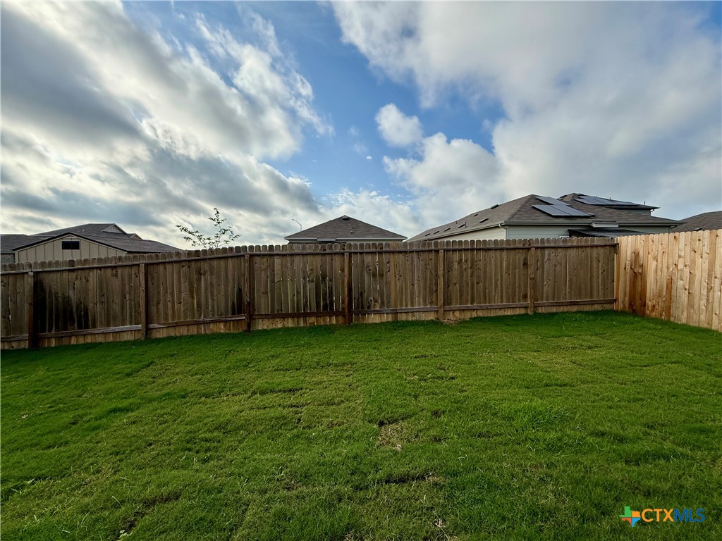 311 Moscato Road New Braunfels, TX 78130 - Photo 37 of 38 a view of a backyard with wooden fence