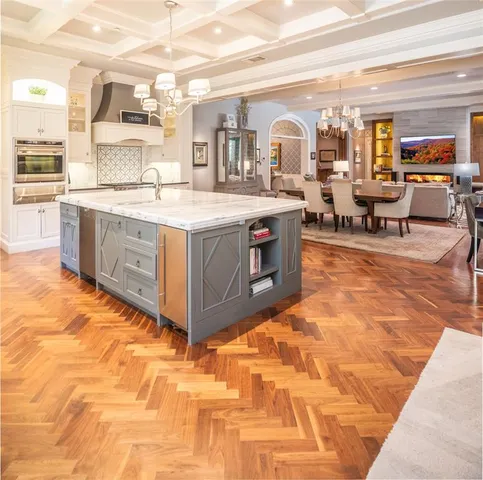 a spacious bathroom with a tub double vanity and sink