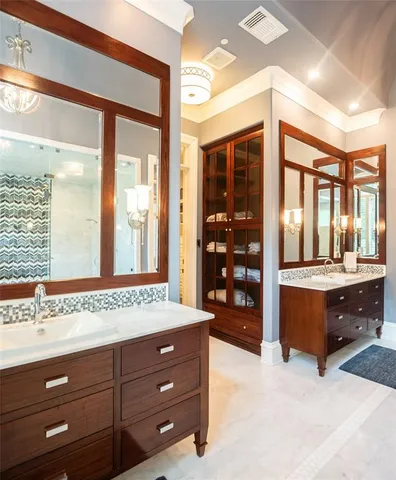 a spacious bathroom with a tub and a large window