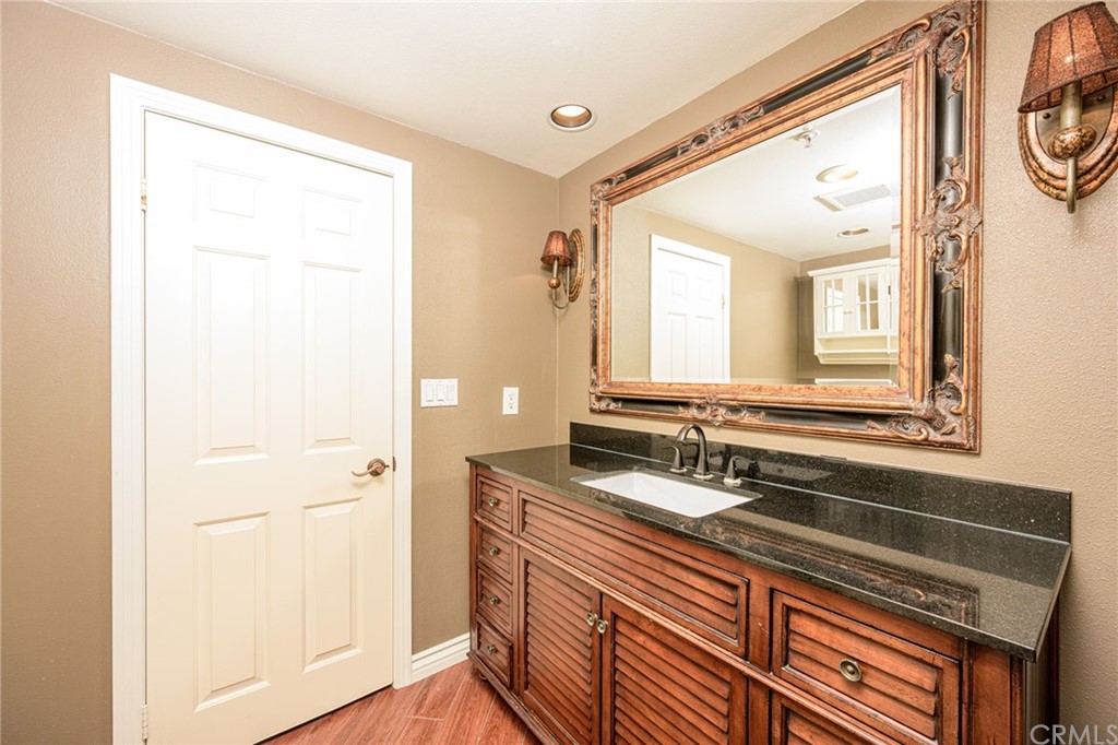 2243 Martin, Unit 409 Irvine, CA 92612 - Photo 17 of 43 a bathroom with a sink a mirror and a shower