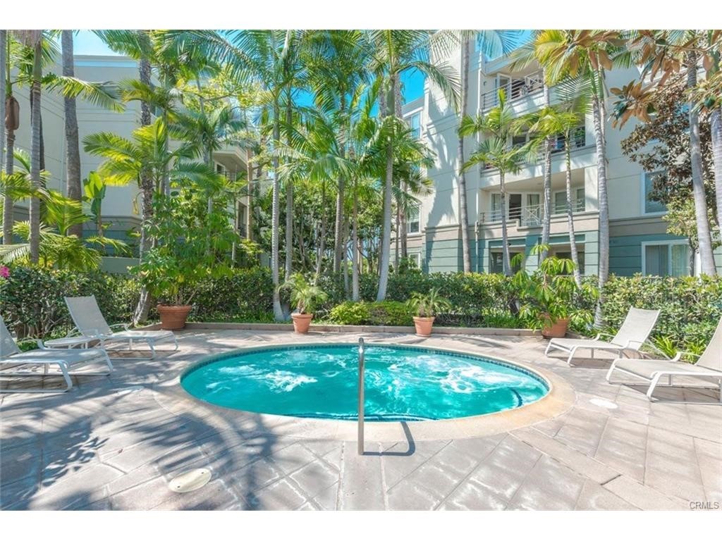 2243 Martin, Unit 409 Irvine, CA 92612 - Photo 34 of 43 a view of a swimming pool with a patio