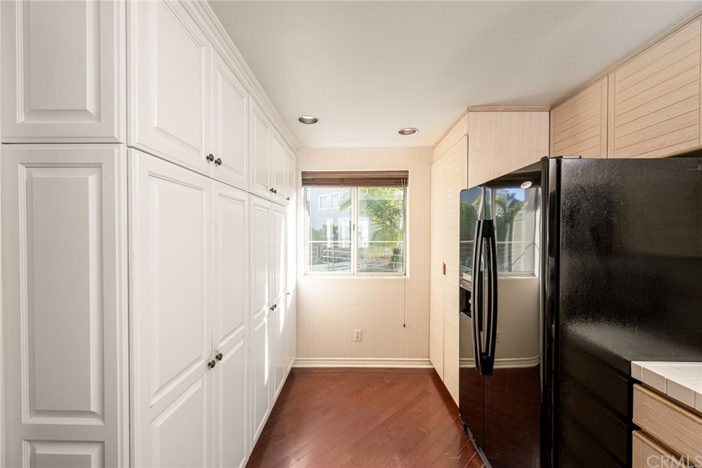 2243 Martin, Unit 409 Irvine, CA 92612 - Photo 5 of 43 a kitchen with stainless steel appliances a refrigerator and a cabinets