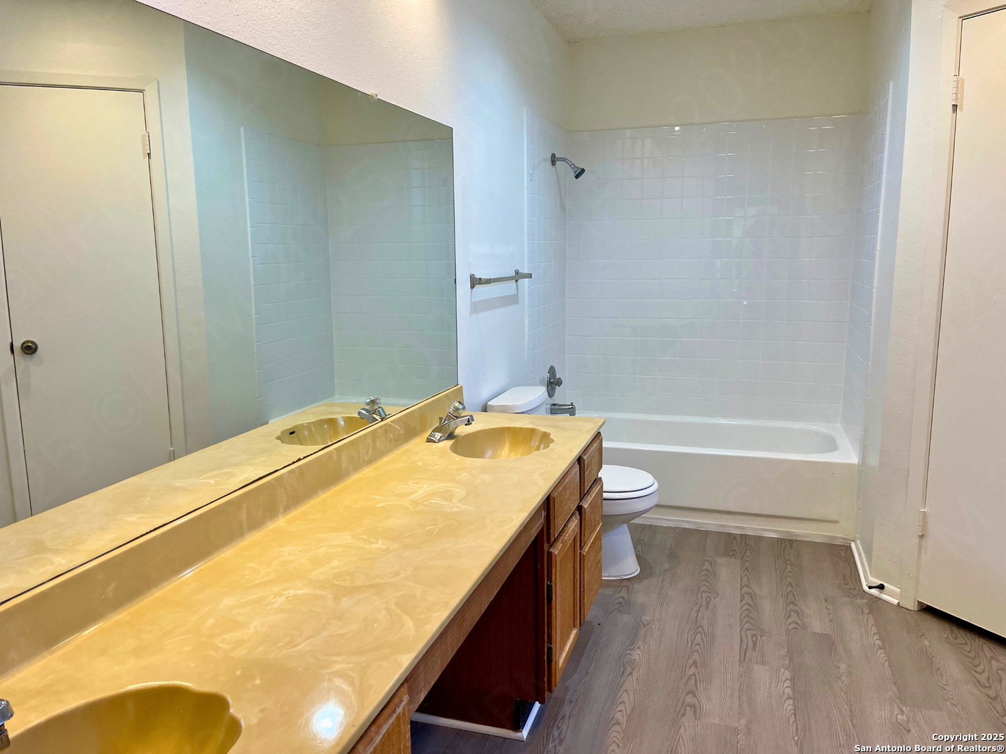 7315 Ridge Beach Drive Converse, TX 78109 - Photo 7 of 17 a bathroom with a granite countertop sink toilet and shower