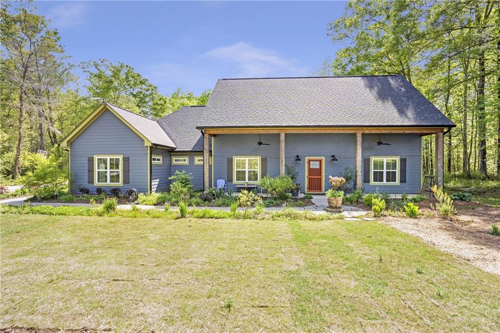 a front view of a house with a yard