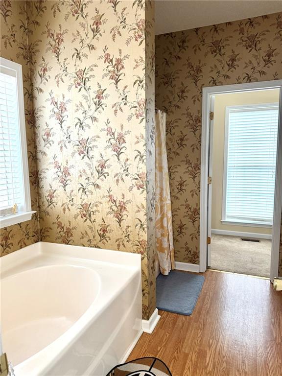 181 Masters Cove Macon, GA 31211 - Photo 6 of 16 a bathroom with bathtub and shower