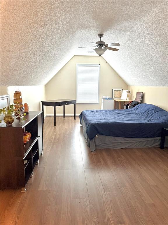 181 Masters Cove Macon, GA 31211 - Photo 8 of 16 a bedroom with a bed and a chandelier