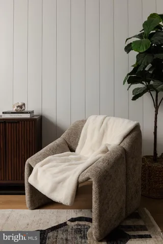 a bed sitting in a bedroom next to a cabinet