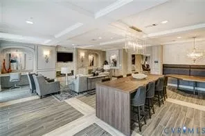 a large kitchen with lots of counter and chairs
