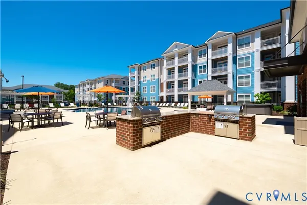 a swimming pool with outdoor seating