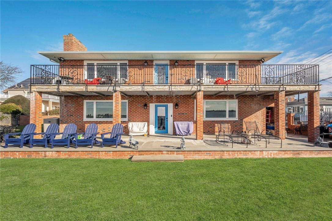 a front view of a building with outdoor seating