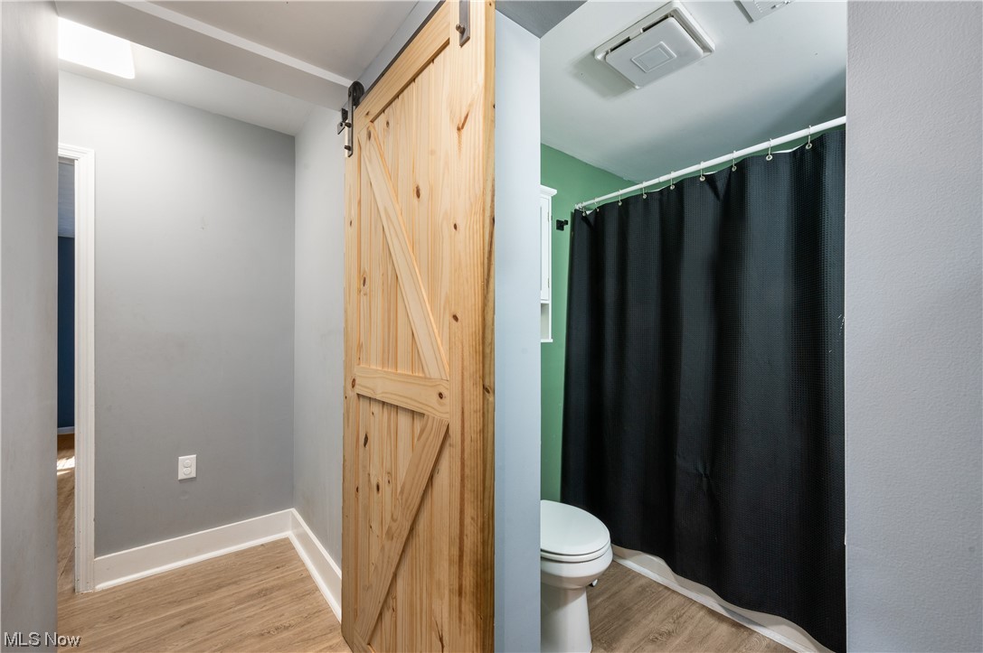3867 Randolph Road Mogadore, OH 44260 - Photo 17 of 23 Bathroom featuring wood-type flooring and toilet