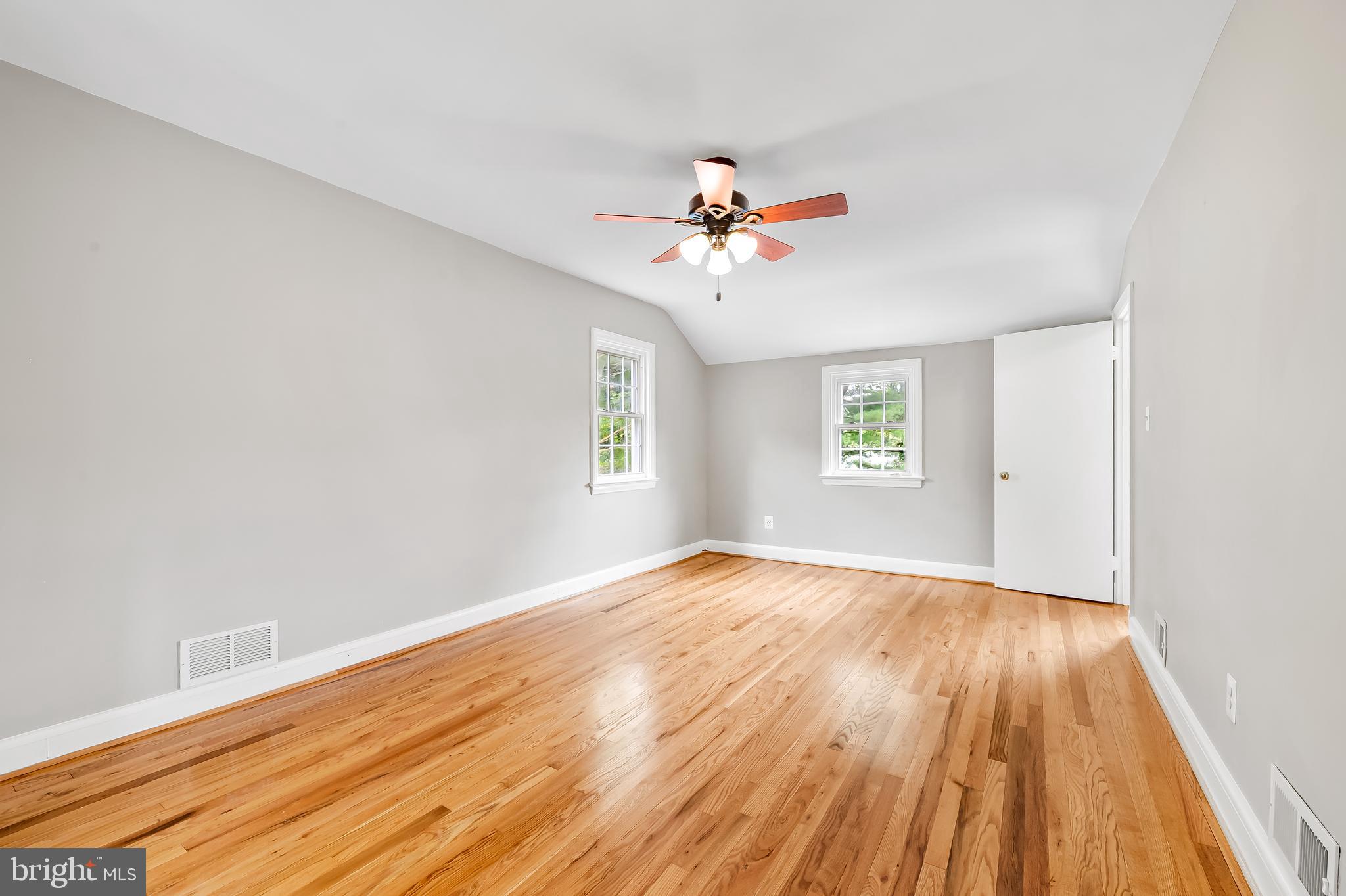 1238 Lake Falls Road Baltimore, MD 21210 - Photo 15 of 28 a view of empty room with wooden floor and fan