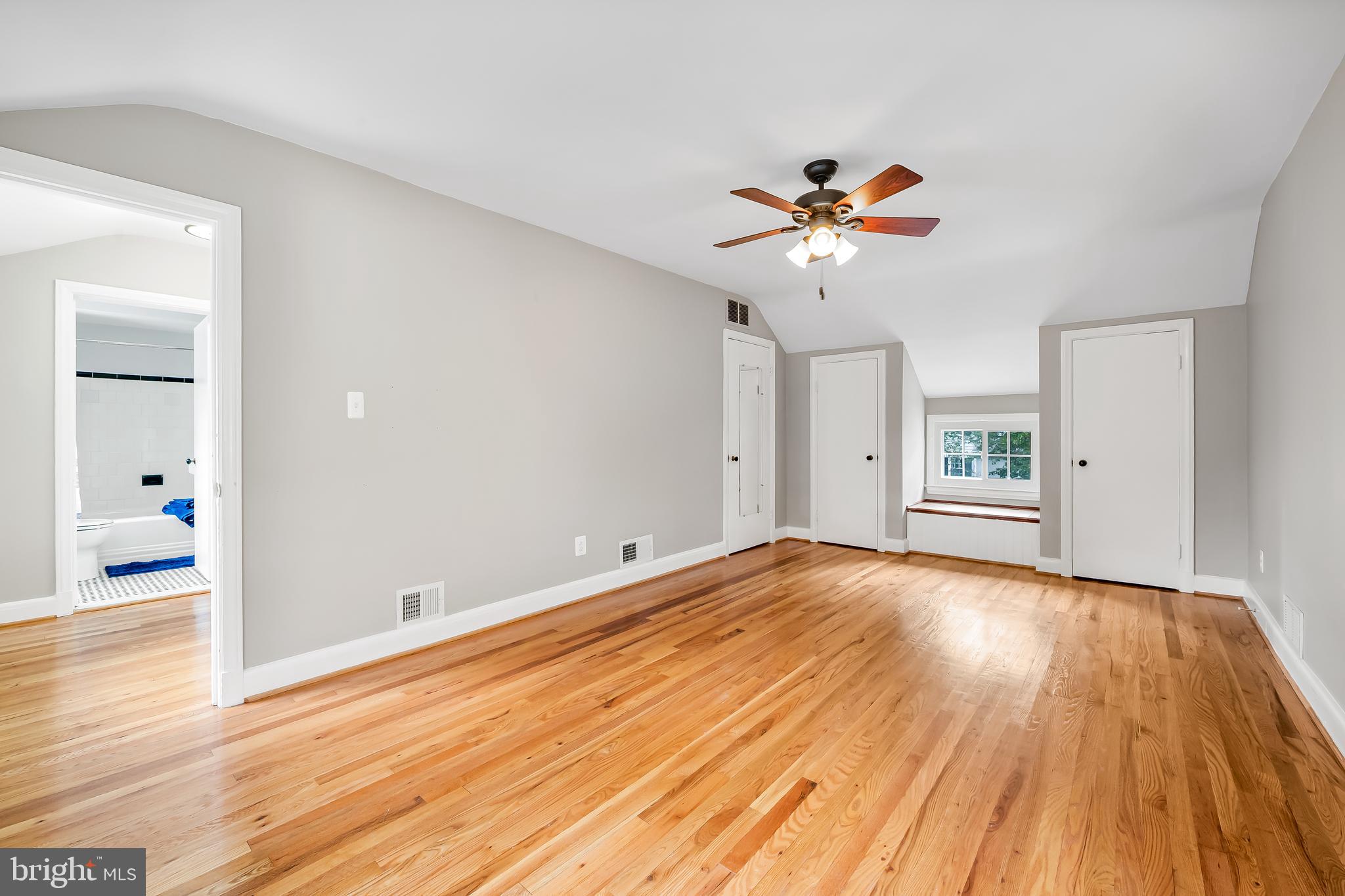 1238 Lake Falls Road Baltimore, MD 21210 - Photo 16 of 28 wooden floor in an empty room with a window