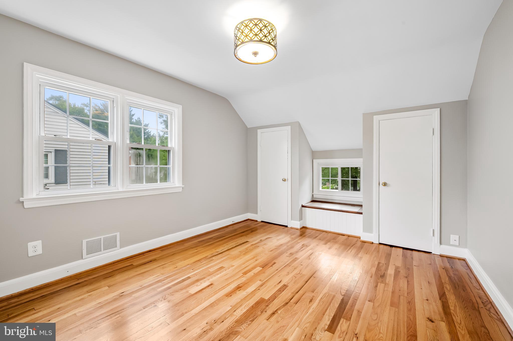 1238 Lake Falls Road Baltimore, MD 21210 - Photo 17 of 28 a view of empty room with wooden floor and fan