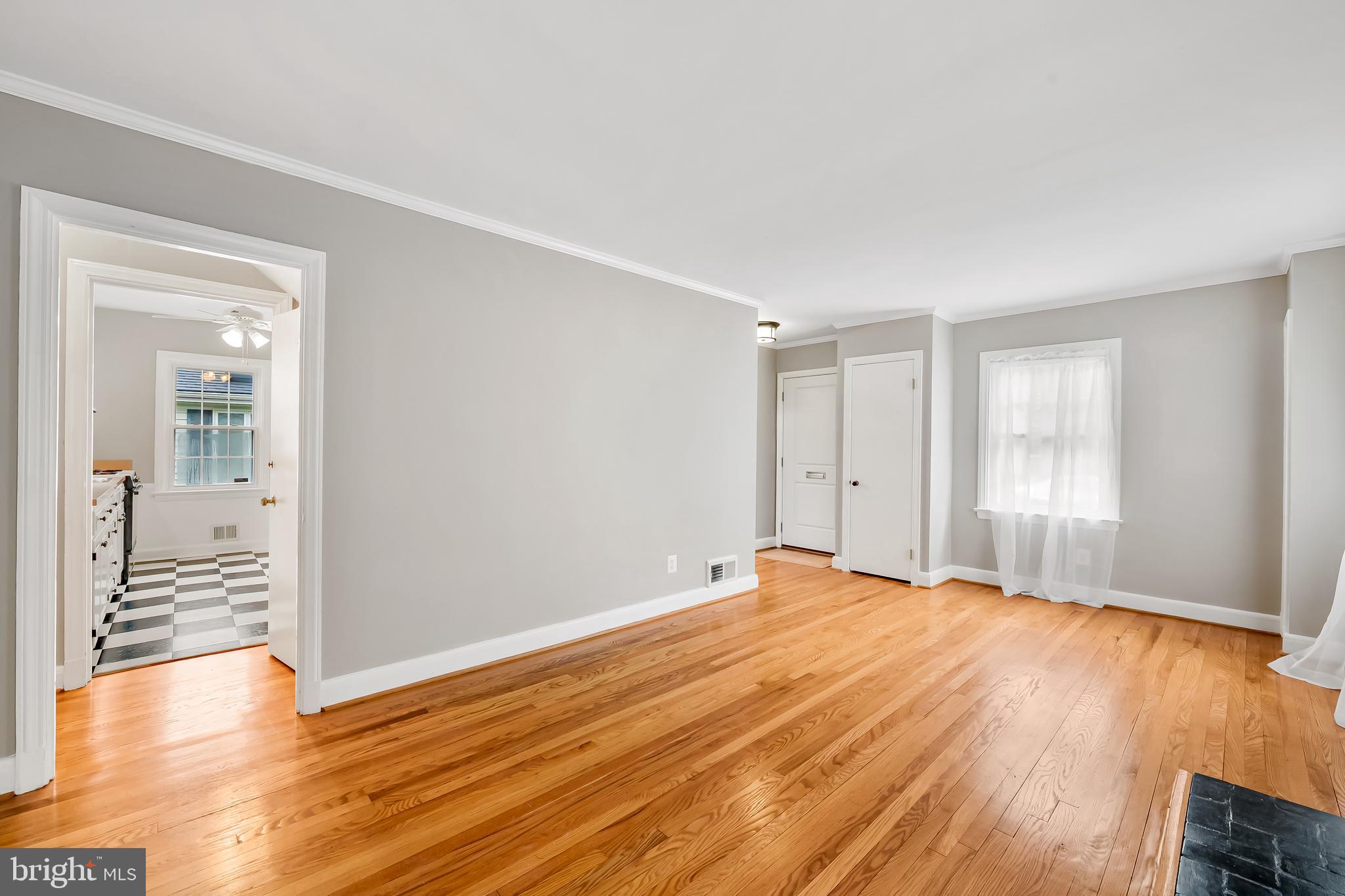 1238 Lake Falls Road Baltimore, MD 21210 - Photo 6 of 28 a view of an empty room with wooden floor