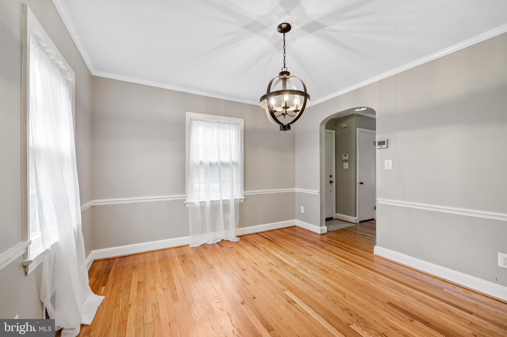 1238 Lake Falls Road Baltimore, MD 21210 - Photo 7 of 28 a view of empty room with wooden floor and fan