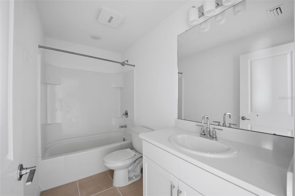 2407 Paravane Way Wesley Chapel, FL 33543 - Photo 11 of 32 a bathroom with a sink toilet and shower