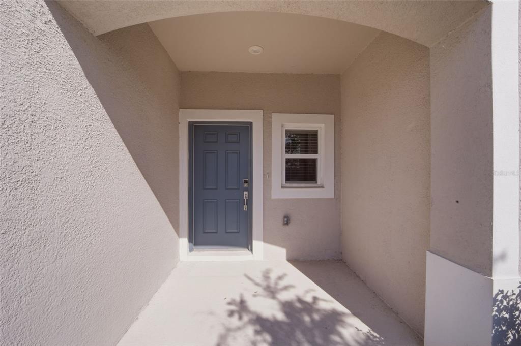 2407 Paravane Way Wesley Chapel, FL 33543 - Photo 2 of 32 a view of a hallway with a white walls